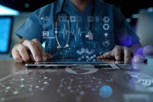 Doctor using a digital tablet with medical icons and heartbeat graphics overlayed on the image.
