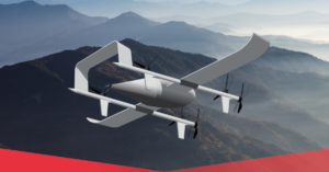 Futuristic drone flying over misty mountains with a red geometric shape in the foreground.