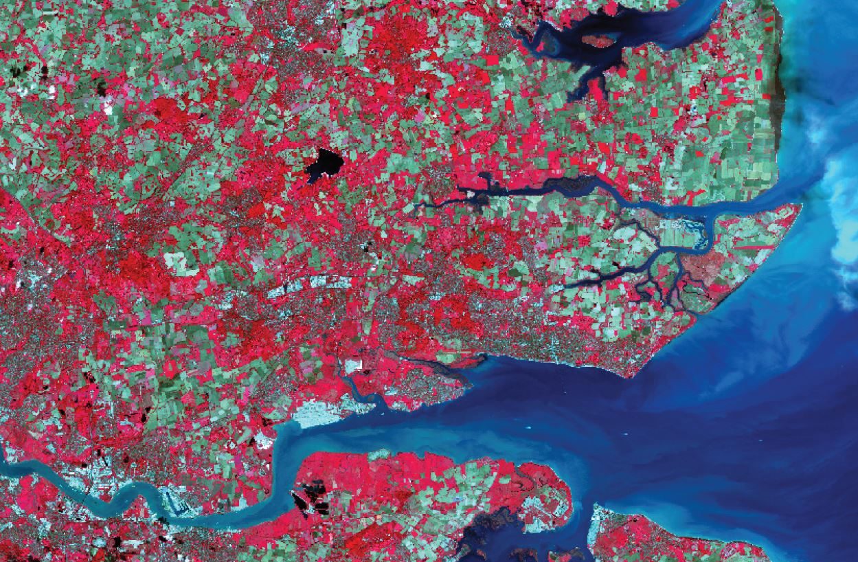 Satellite view of a landscape with red and green colors, titled "Geospatial Innovation in 2020.