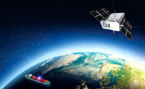 Satellite orbiting Earth, viewing continents and oceans with a ship sailing below on the water's surface.