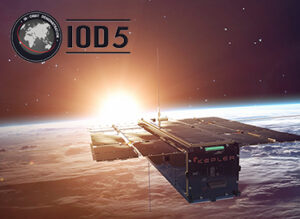 A satellite labeled "KEPLER" orbits above Earth with the sun rising in the background, and a logo reading "IOD5.