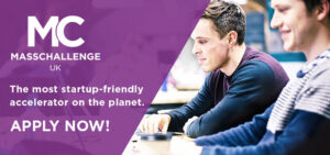 Two people working on laptops with text: "MC MassChallenge UK. The most startup-friendly accelerator. Apply now!.