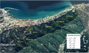 Aerial view of a coastal area with landslide velocity map, marked zones, and color-coded velocity legend.