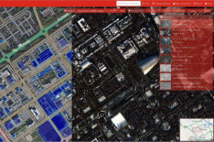 Aerial map view split in half, one side colored, the other in grayscale, with a navigation bar on top.