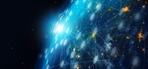 Glowing Earth with network lines and nodes, highlighting connections and bright clusters from space.