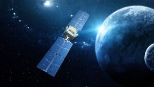 A satellite with solar panels orbits in space, with a distant planet and stars in the background.