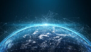 Digital globe with glowing network lines and data points against a starry sky, illustrating global connectivity.