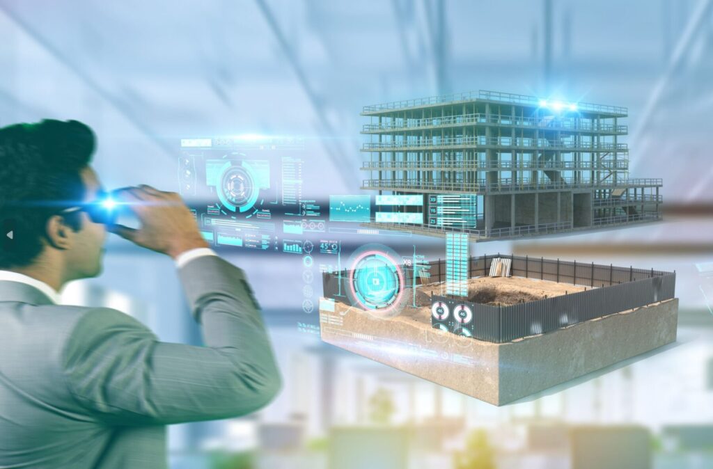 Person using AR headset to view a digital construction project with holographic interface in an office setting.