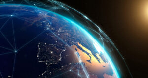 Digital Earth view with glowing network connections over Europe at sunrise, highlighting illuminated cities and landscape.