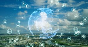 A digital globe over a cityscape with floating technology icons against a cloudy sky background.