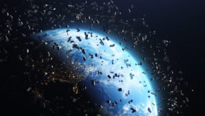 Space debris orbiting Earth against a backdrop of city lights on the planet's surface.