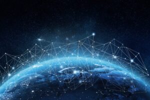 Blue earth from space with glowing network lines and nodes over a starry night background.