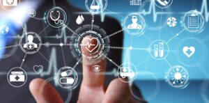 A person touching a screen displaying various digital health icons connected by lines, symbolizing healthcare technology.
