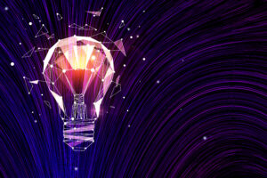 A polygonal light bulb shatters against a swirling purple and blue background, symbolizing a burst of ideas.