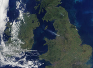 Satellite view of the British Isles, showing Ireland and Great Britain with some cloud cover over the Atlantic Ocean.