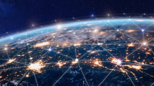 A view of Earth from space at night with interconnected glowing points representing global connectivity.