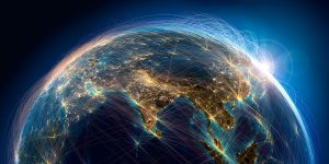 A view of Earth from space showing illuminated cities and lines representing global connections.