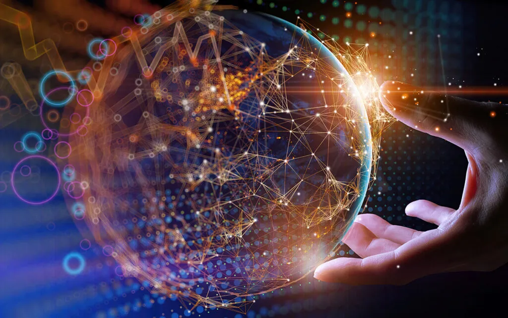 A hand holding a globe.