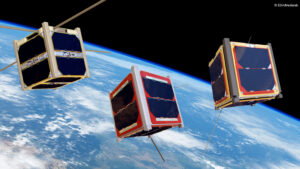 Three cube satellites orbit Earth with antennas extended, against a backdrop of the blue planet and space.