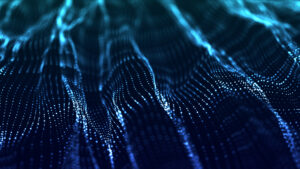 A digital landscape made of glowing blue dots and lines, resembling a 3D grid or wave pattern.