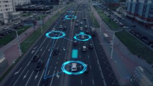 Aerial view of cars on a busy road with glowing blue indicators showing autonomous vehicle technology.