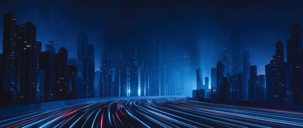Futuristic cityscape at night with glowing blue skyscrapers and light trails from fast-moving vehicles.