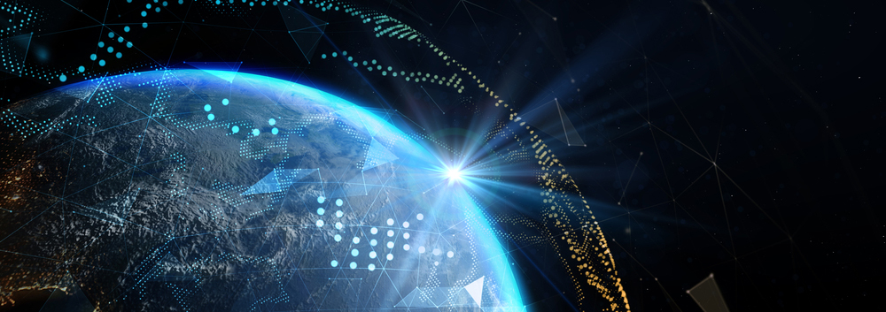 Earth from space with digital data graphics and a bright light on the horizon, symbolizing global technology.