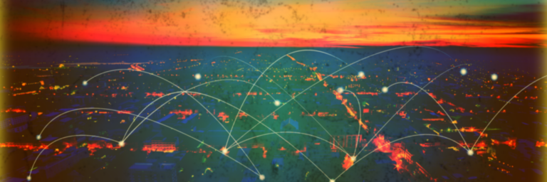 Cityscape at sunset with glowing network lines and nodes connecting various points across the urban landscape.