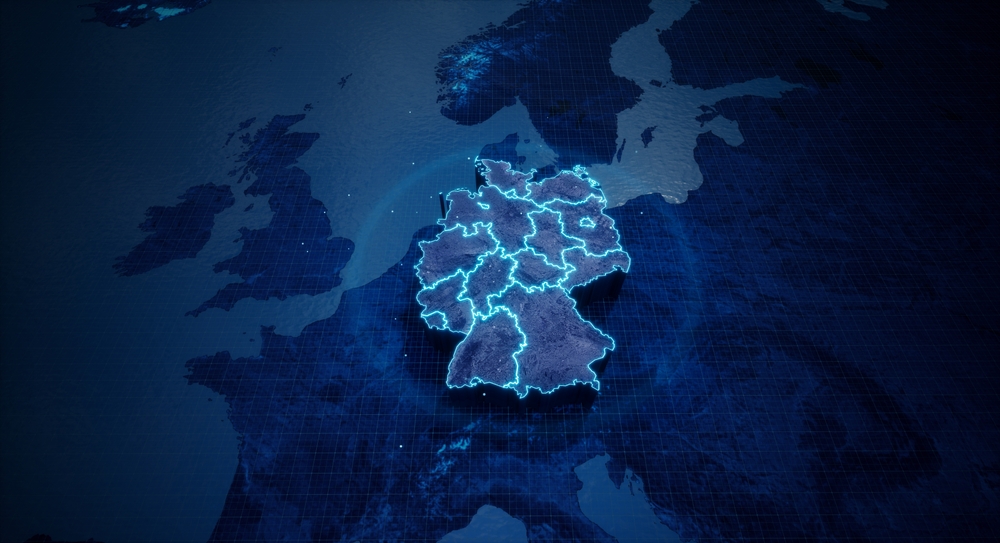 A digital map highlights Germany with glowing borders and state divisions within Europe.